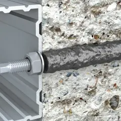 Przekrój profilu aluminiowego z widoczną śrubą i nakrętką, połączony z betonem za pomocą kotwy.